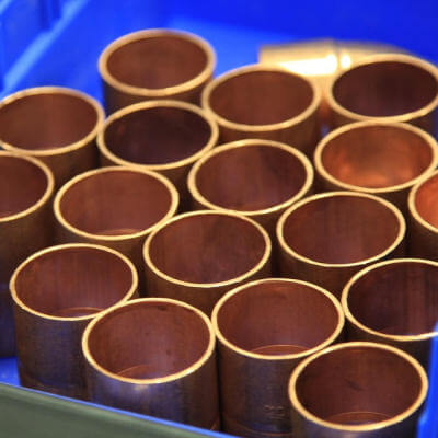 Image of a stack of copper pipes
